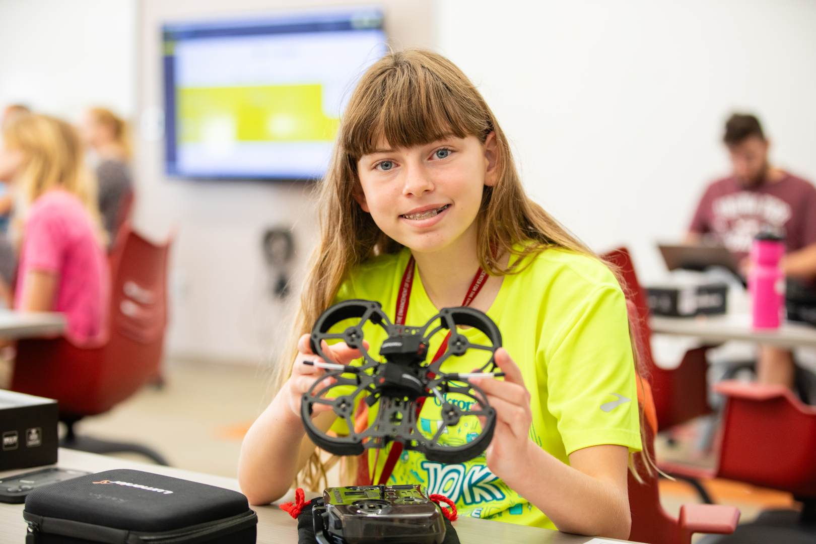 A student showing off her drone
